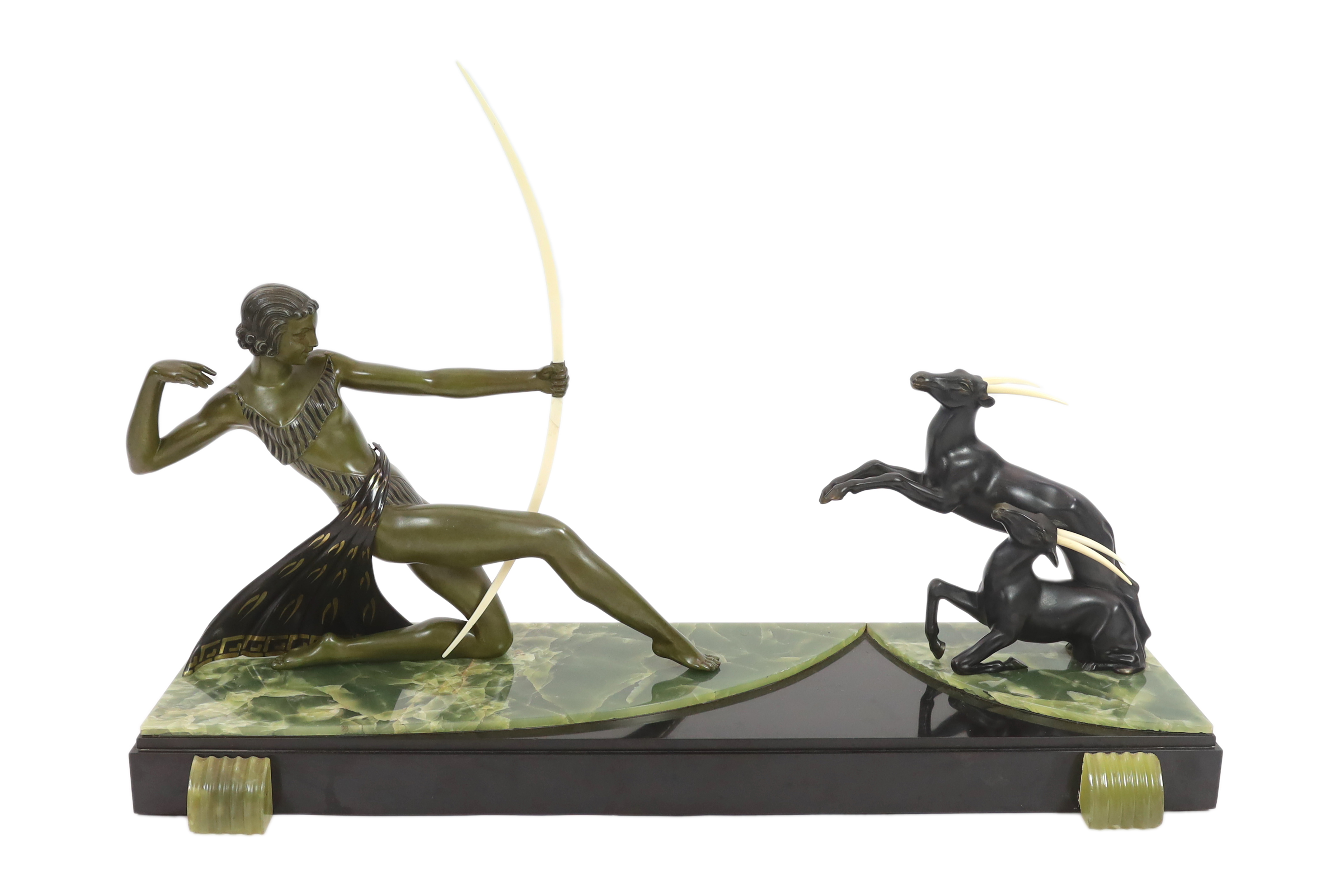 Attributed to Ugo Cipriani (Italian, 1887-1960). An Art Deco bronzed spelter group of an archer shooting at two antelopes, 82cm wide, 24cm deep, 55cm high